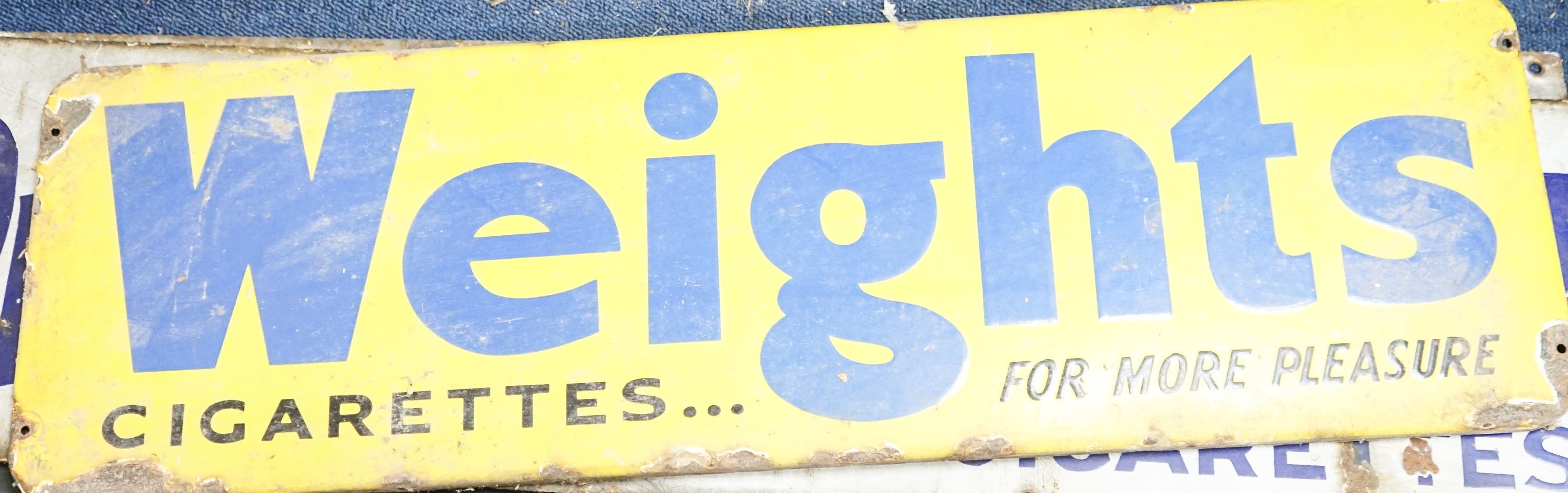 Three enamel advertising signs, 'Players navy Cut' and 'Weights', widest 91 cm